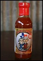 Custom caricature artwork printed on Snow's BBQ sauce bottle packaging